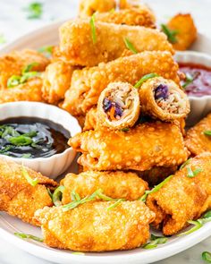 fried food on a plate with dipping sauce