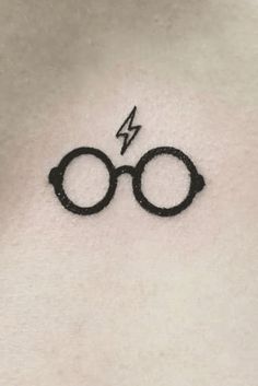 a harry potter symbol tattoo on the chest