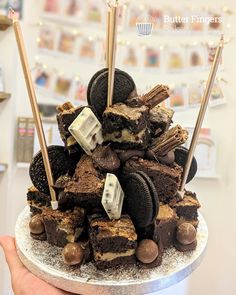 there is a cake made to look like oreo cookies and brownies on top