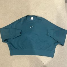 Never Worn. Size M. Perfect Condition. Oversized Blue Athleisure Sweatshirt, Blue Oversized Athleisure Sweatshirt, Light Blue Long Sleeve Athleisure Sweatshirt, Light Blue Sporty Tops For Fall, Oversized Blue T-shirt, Light Blue Athleisure Tops For Fall, Oversized Green Sports Top, Blue Oversized T-shirt For Sports, Nike Athleisure Tops With Ribbed Cuffs