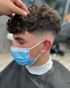 Trendy Men’s Hair, Mid Fade Curly Hair Men, Haircut For Curly Hair Boys, Mens Perm Fade, Short Curly Boys Haircut, Low Fade Curly Hair Men, Curly Hair Fades For Men, Boys Haircut Curly