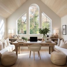 a living room filled with furniture and windows