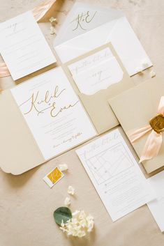 the wedding stationery is laid out and ready for guests