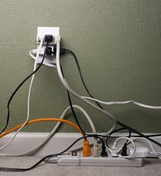 an electrical outlet with multiple wires attached to it