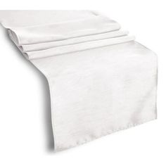 four white napkins folded on top of each other