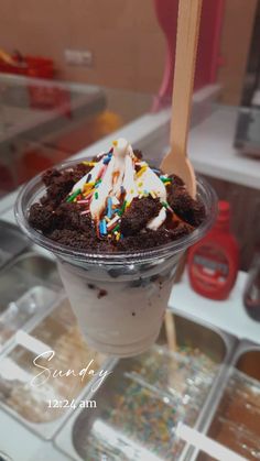 an ice cream sundae with chocolate and sprinkles