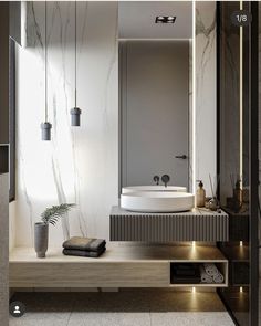 a bathroom with a large mirror, sink and bathtub in it's center