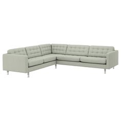 a large sectional couch sitting on top of a white floor