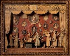 this is an image of a dollhouse scene with dolls and other things in it