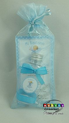 a packaged package with a blue ribbon around it's neck and an image of a cupcake in the bag