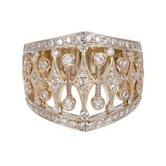 Wide Diamond flat Parviz ring with white gold shank. The top is white gold on the sides with yellow gold diamond shapes and Rose gold round tubes. 85 full cut diamonds, approx. total weight .70cts, G, VS1 to SI1 10.4 grams Size 7 and sizable Stamped: 18k 18k white, yellow and rose gold Tested: 18k Hallmark: Parviz Width at top: 17.4mm Height at top: 3.5mm Width at Bottom: 7.3mm Luxury Wide Band Rings With Intricate Design, Elegant Diamond White Ring With Decorative Band, Elegant White Ring With Decorative Band, Heirloom Diamond Ring With Wide Band, Fine Jewelry Diamond Ring With Decorative Band, White Wide Band Rings With Single Cut Diamonds, Decorative Diamond Band With Round Cut, Round Cut Diamond Rings With Decorative Band, Diamond Jewelry With Decorative Band Round Cut