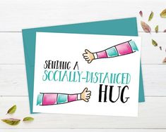 a greeting card with the words sending a socially - distracted hug