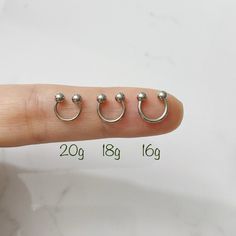 the finger has four balls on it and is marked with two different size hooks in each