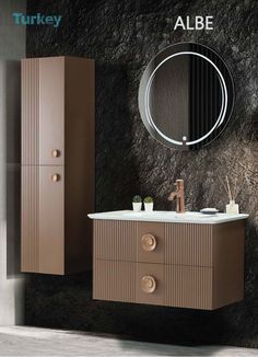 a bathroom with a sink, mirror and cabinet in brown color on the wall next to it