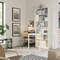 a living room filled with furniture and bookshelves