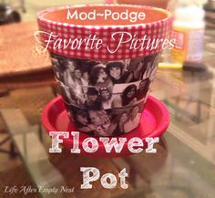 flower pot sitting on top of a table with the words mod - podge favorite pictures above it