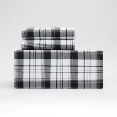 two black and white plaid sheets on top of each other