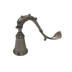 an old fashioned metal faucet with ornate decorations on the top and bottom, against a white background