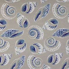 a blue and white fabric with shells on it's back side, in various sizes