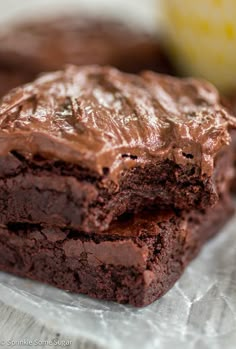 two chocolate brownies sitting on top of each other