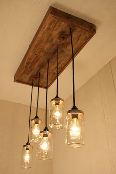 mason jar chandelier with lights hanging from the ceiling