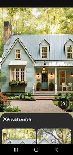 an image of a blue house with white trim and windows on the front, and in the back