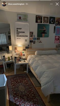 a bed room with a neatly made bed and lots of pictures hanging on the wall