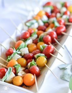 several skewers filled with different types of vegetables