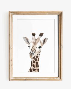 a giraffe's head is framed in a wooden frame on the wall