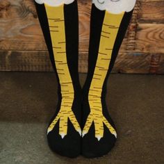 the legs and feet of a person wearing yellow socks