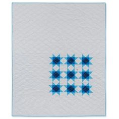 a blue and white quilt with squares on it