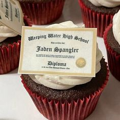 several cupcakes with white frosting and a plaque on top that reads, celebrating after high school