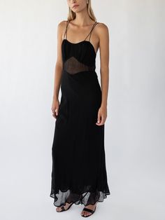 Stunning classic black maxi dress with sheer empire panel and double strap design. Cut on the bias and slightly sheer fabric. Measurements: 0 (XS): Bust 32.5"-33.5" Waist 24"-25" Hips 34"-35" 1 (S): Bust 34"-35" Waist 25"-26" Hips 35"-36" 2 (M): Bust 35"-36" Waist 26"-27" Hips 36"-37" 3 (L): Bust 36"-37" Waist 27"-28" Hips 37"-38" 100% Viscose, dry clean only Elegant Black Sheer Slip Dress, Black Slip Dress With Fitted Bodice For Night Out, Black Slip Dress With Fitted Bodice For Party, Black Slip Dress With Fitted Bodice For Gala, Fitted Sheer Slip Dress For Evening, Elegant Maxi Dress With Sheer Back For Date Night, Elegant Sheer Back Maxi Dress For Date Night, Summer Evening Slip Dress With Sheer Back, Chic Evening Slip Dress With Sheer Back