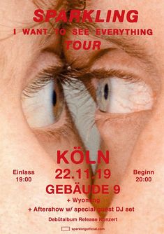 an advertisement for a concert with two blue eyes