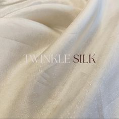 Twinkle Silk is a luxurious fabric known for its softness, sheen, and fine texture. It is commonly used in traditional Indian clothing such as sarees and ethnic wear. The qualities of Upada silk include its lightweight feel, smooth drape, and the ability to showcase intricate embroidery or embellishments beautifully. It is favored for special occasions due to its elegant appearance and comfort. fabric quality:- PURE TWINKLE SILK FABRIC ( WHITE FABRIC ) Fabric :- PURE HAND DYED FABRIC FROM OUR ARTISAN. Elegant Raw Silk Fabric For Festive Occasions, Elegant Silk Mark Certified Silk Dupatta, Elegant Silk Fabric For Festive Occasions, Elegant Silk Mark Certified Raw Silk Saree, Elegant Silk Fabric For Eid, Elegant Festive Raw Silk Fabric, Elegant Fabric For Eid With Traditional Drape, Elegant Raw Silk Saree With Silk Mark, Elegant Tussar Silk Fabric For Wedding