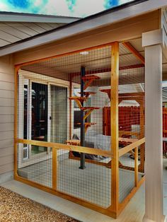 a house with a large cage on the front porch