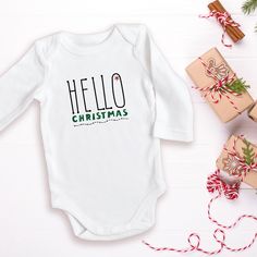 Just saying 'Hello' to the season with this super soft onesie! Welcome in the season with warmth and laughter for your favorite little one. Cricut Baby Onesie Christmas, Long Sleeve Holiday Onesie, Cute Christmas Holiday Onesie, Holiday Onesies, Christmas Long-sleeve Playtime Onesie, Christmas Onesie, Funny Onesies, Holiday Collection, Little One