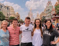 a group of people standing in front of a street