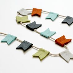 an assortment of felt pieces on a string