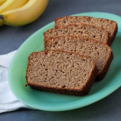 four slices of banana bread on a green plate