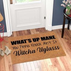 a door mat that says what's up maine you find rock art if witch class