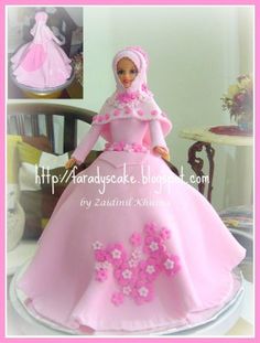 a barbie doll in a pink dress with flowers on it