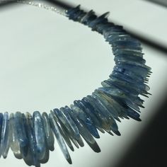 "Dramatic blue stick kyanite beads strung on silk thread and suspended on sterling silver chain.  Total length = 17\"." Kyanite Necklace, Wrapped Jewelry, Bead Stringing, Beaded Necklaces, Silk Thread, Sterling Silver Chain, Wire Wrapped Jewelry, Sterling Silver Chains, Wire Wrapped