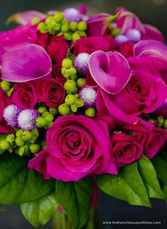 a bouquet of pink roses and green leaves in front of a black background with the word love written on it