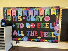 a bulletin board that says it's okay to feel all the feels on it