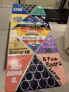 a triangle made out of different types of beer labels