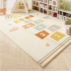 a child's playroom with toys and bookshelves on the floor in front of it