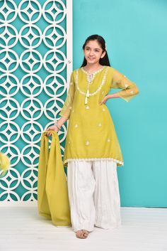 Up the style ante of your little one by giving this feminine traditional look a feisty twist.Description : Kameez (Shirt) : Shirt with Embroidery Work and Lining Inside. Shalwar (Pants) : White crush Gharara. Dupatta (Scarf) : Embellished Dupatta. Pista Green Zari Work Sets For Summer, Pista Green Sharara With Dabka For Eid, Pista Green Dabka Sharara For Eid, Eid Pista Green Sets With Dabka Work, Eid Sets In Pista Green With Dabka Work, Eid Pista Green Dabka Work Sets, Green Sets With Dori Work For Summer, Festive Sets With Dabka Work For Spring, Traditional Pista Green Sets For Summer