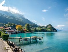 a wooden dock sitting in the middle of a lake