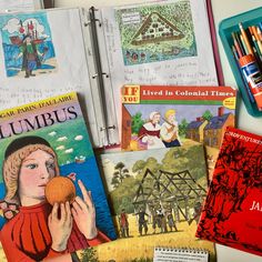 children's books and crayons on a table